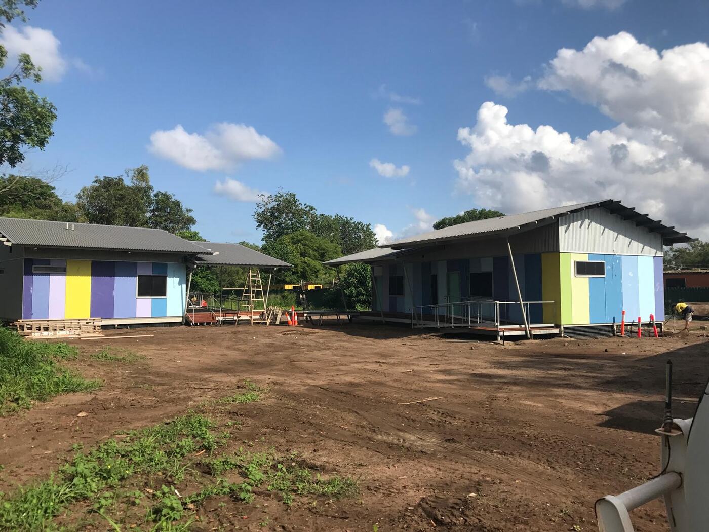 Newly built community houses under construction in a remote tropical community