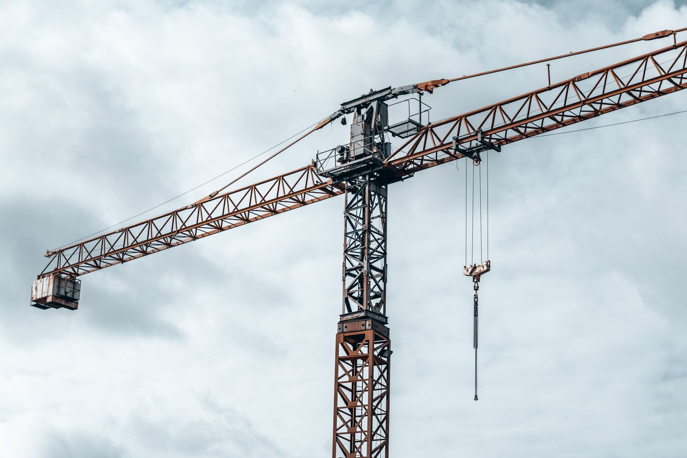 Tower crane against an overcast sky on a construction programme